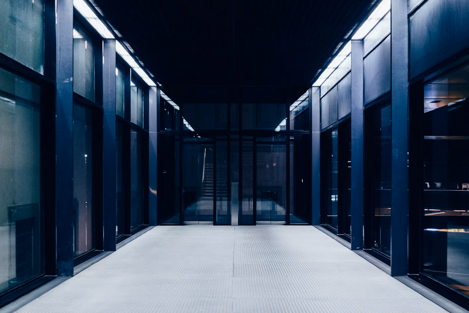 An aisle between rows of server cabinets in a data centre